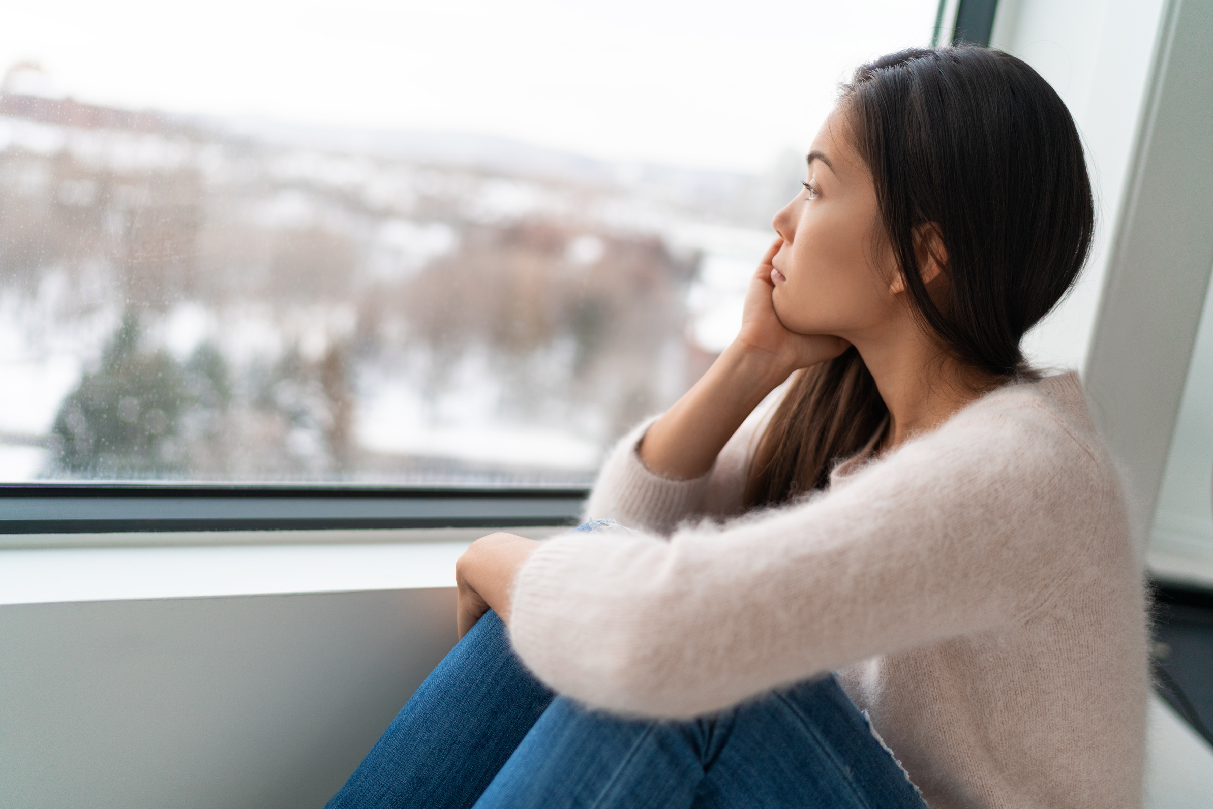 Sad Woman by the Window